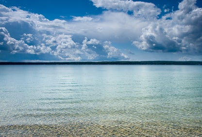 Clear blue water and blues skies at Burt Lake