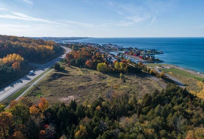 Aerial view over Bay Harbor's rolling hills and waterfront